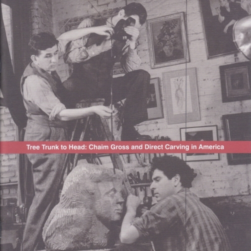 Exhibition catalogue cover, bearing a black and white photograph of director Lewis Jacobs and cameraman Leeo Lances, filming Chaim Gross carve a bust of a woman in his studio. At the center of the image is a horizontal red band, bearing the title of the catalogue, "Tree Trunk to Head: Chaim Gross and Direct Carving in America".